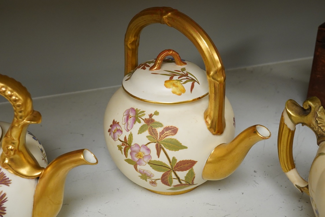 Four 19th century Worcester blush ivory teapots, with floral decoration and decorative handles, largest 20cm wide
